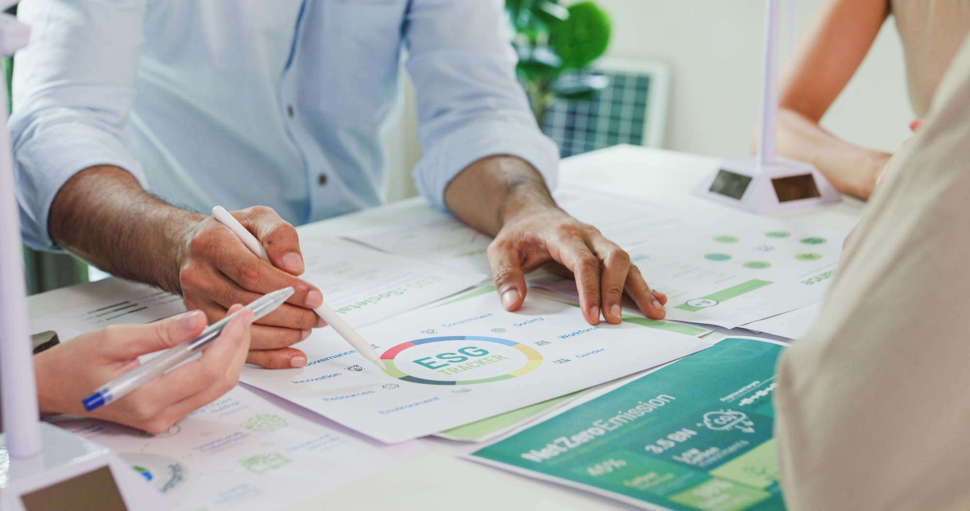 Closeup group Asia businesspeople talk ESG strategies risk management workshop.
